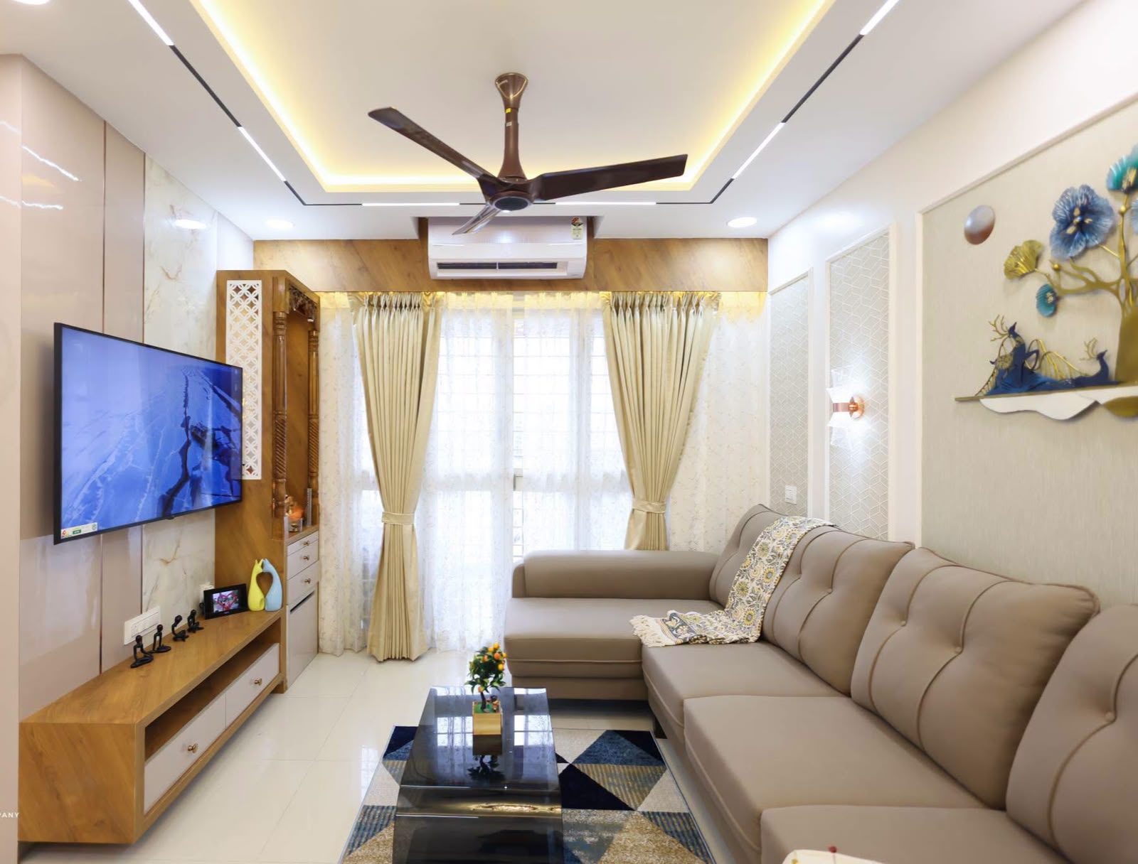 Warm, elegant living room designed by Shloka Interiors, Hyderabad