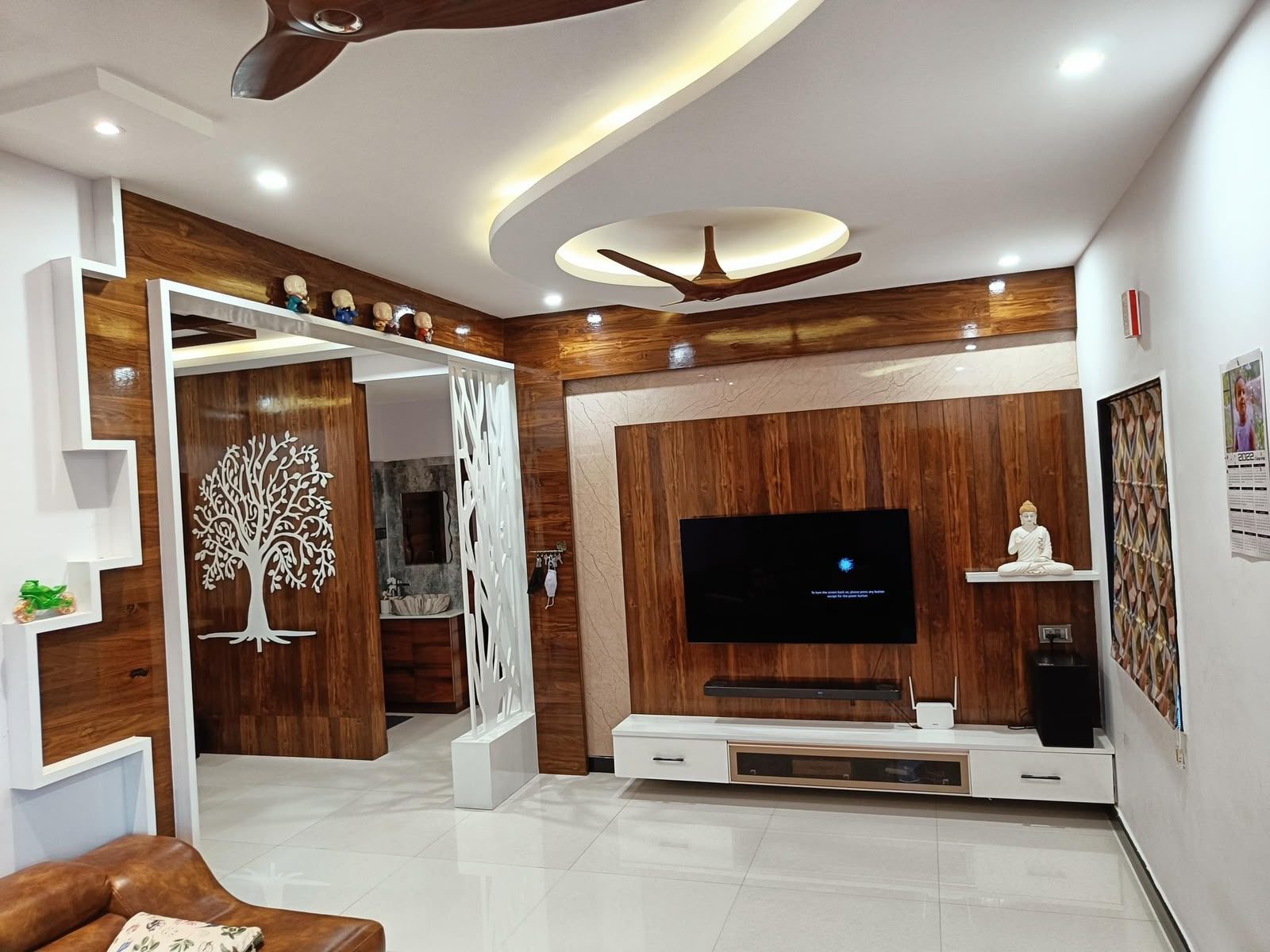 Wood-panelled family lounge with tree motif